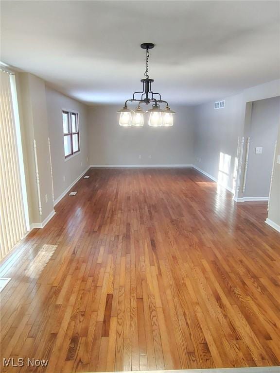 unfurnished dining area with hardwood / wood-style flooring