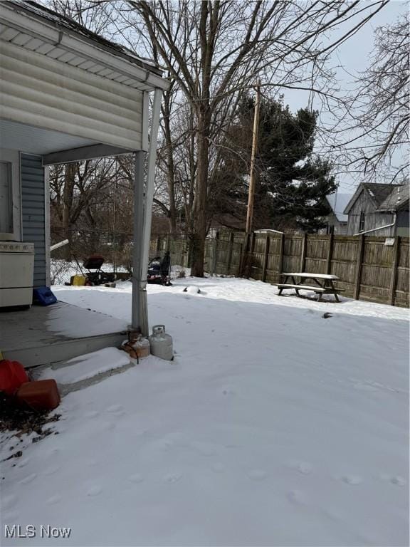 view of yard covered in snow