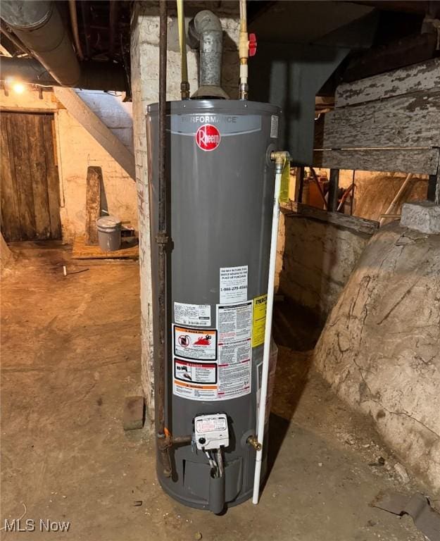 utility room featuring gas water heater