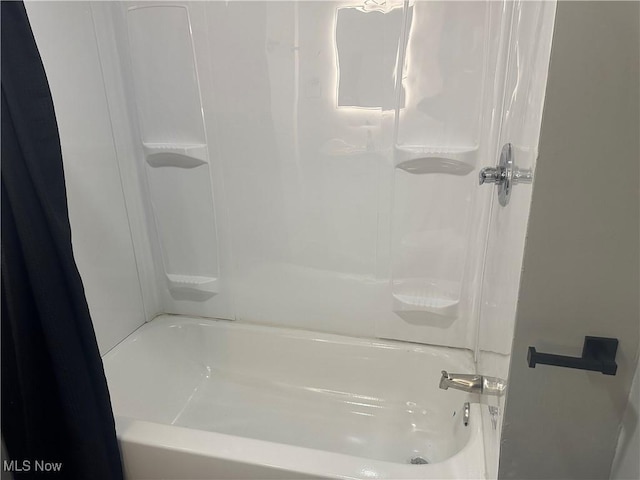 bathroom with shower / bathtub combination