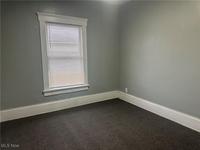 unfurnished room featuring carpet