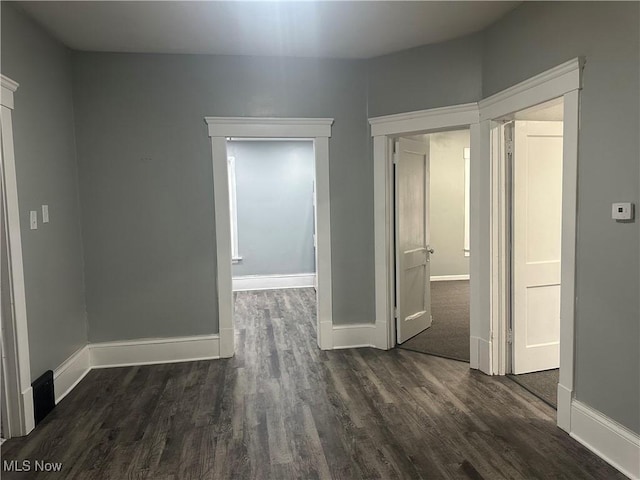 empty room featuring dark hardwood / wood-style floors