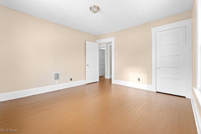 empty room featuring hardwood / wood-style floors