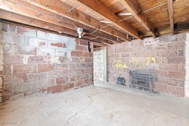 unfurnished living room with concrete flooring