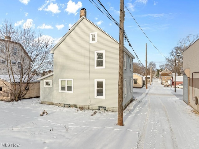 view of snow covered property