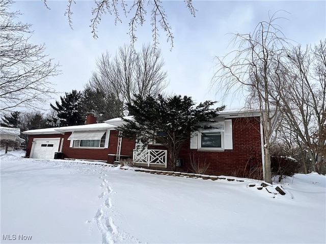 single story home featuring a garage