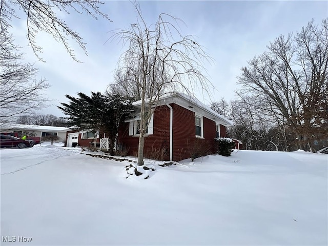 view of snow covered property