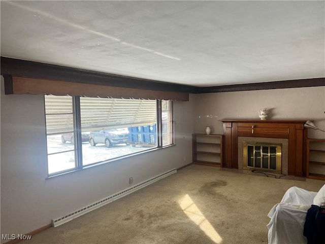 unfurnished living room featuring light carpet and a baseboard heating unit