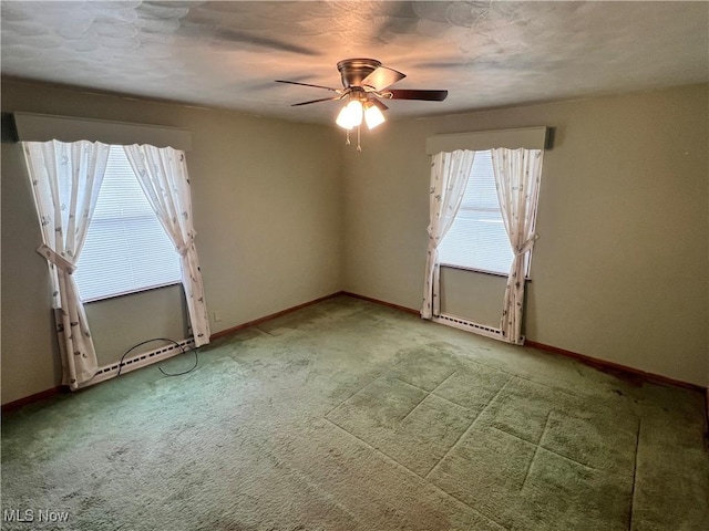 spare room featuring carpet flooring and ceiling fan