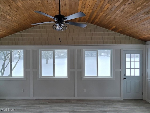 interior space featuring wood ceiling, vaulted ceiling, and a healthy amount of sunlight