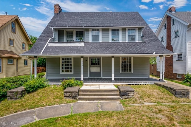 view of front of house with a front lawn and a porch