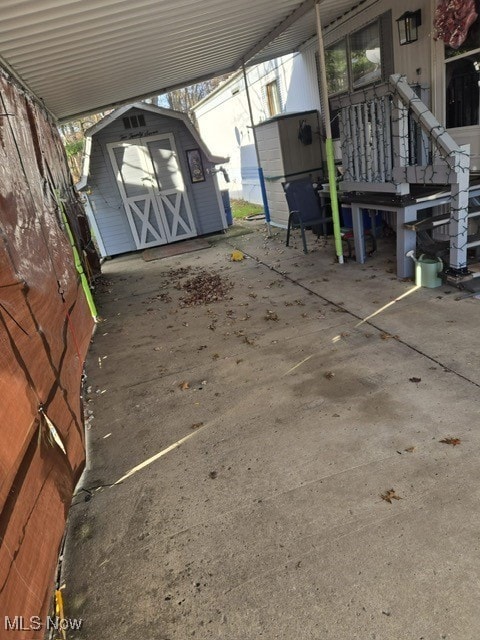 view of patio featuring a storage shed