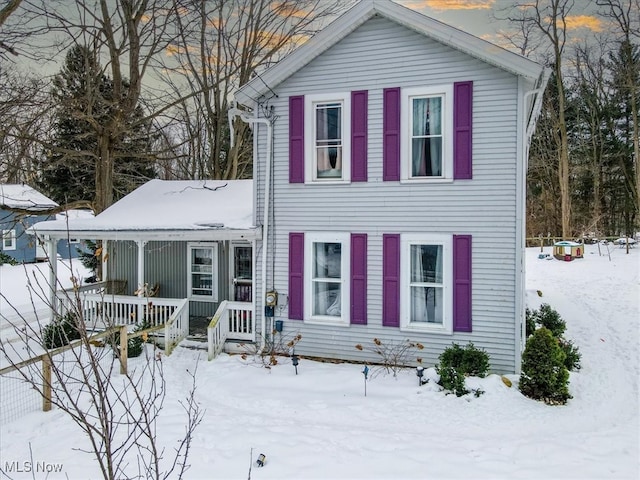 view of front of property featuring covered porch