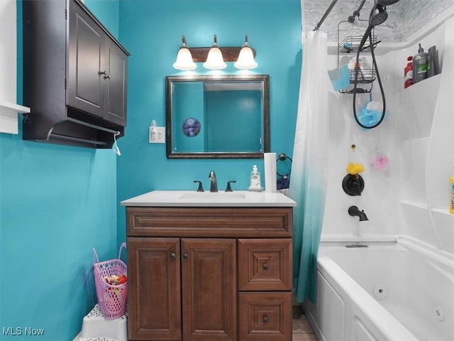 bathroom featuring vanity and shower / bath combination with curtain