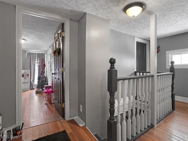 corridor featuring hardwood / wood-style floors