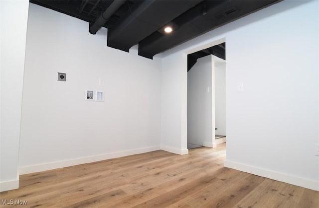 spare room with light hardwood / wood-style flooring