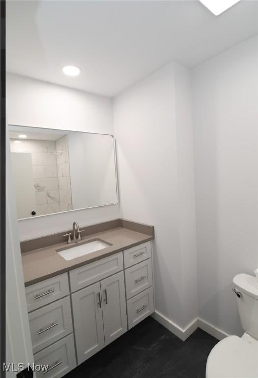 bathroom with vanity and toilet