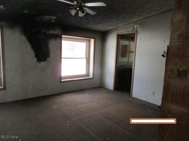 unfurnished room with ceiling fan