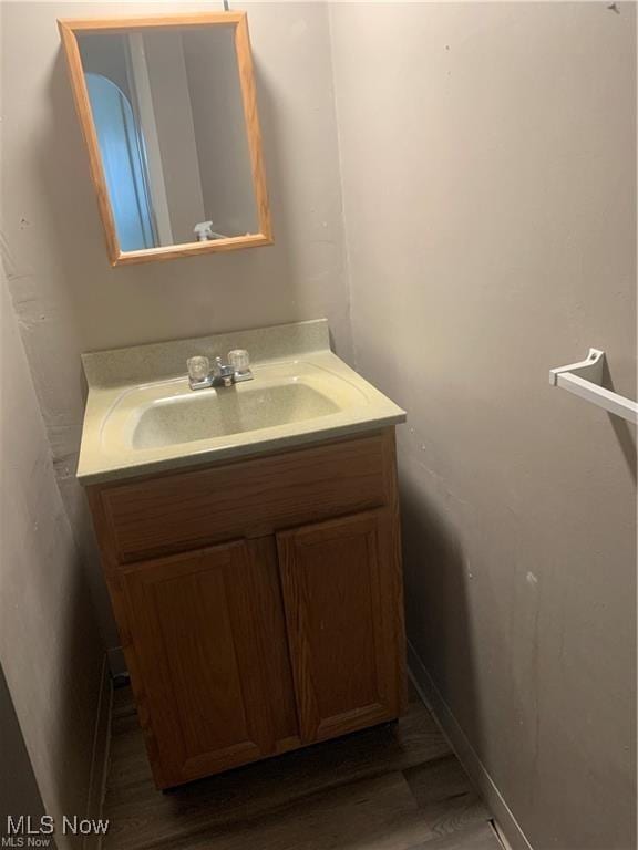 bathroom with vanity and hardwood / wood-style floors