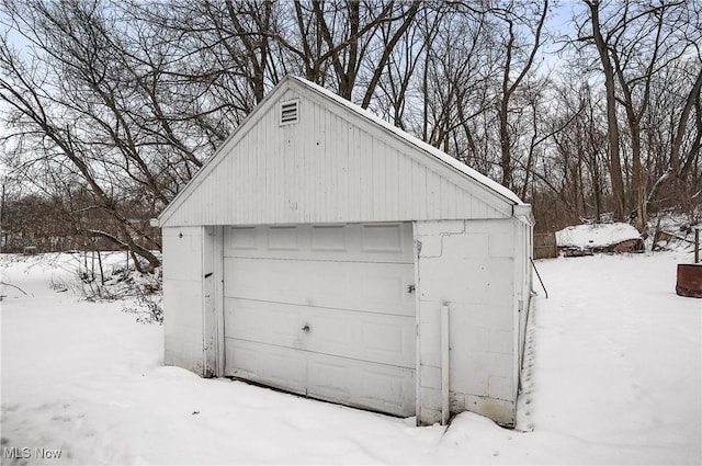 view of snow covered garage