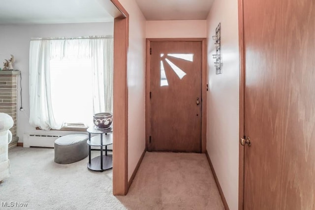 doorway to outside featuring baseboard heating and light colored carpet