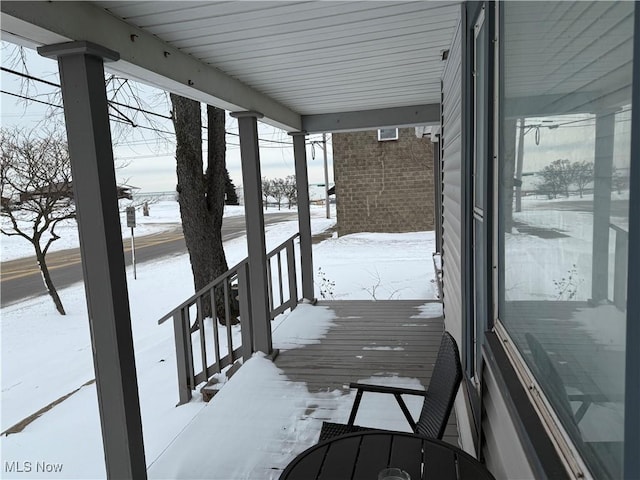 view of snow covered deck