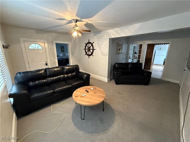 carpeted living room featuring ceiling fan