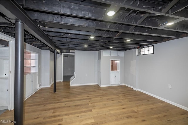 basement with wood-type flooring