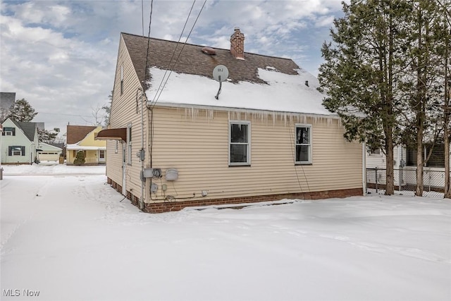 view of snow covered house