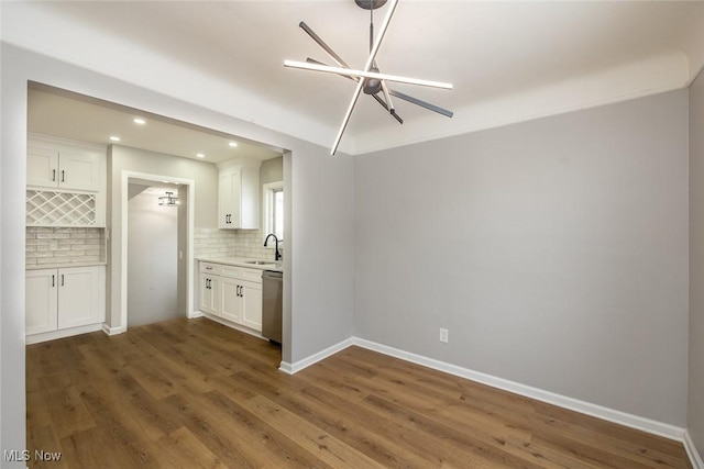 interior space with dark wood-type flooring and sink