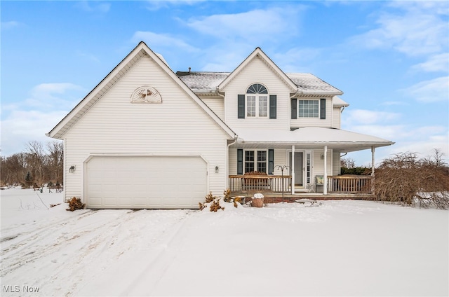 view of front of property featuring a garage and covered porch