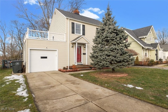 view of front of house with a garage and a front yard