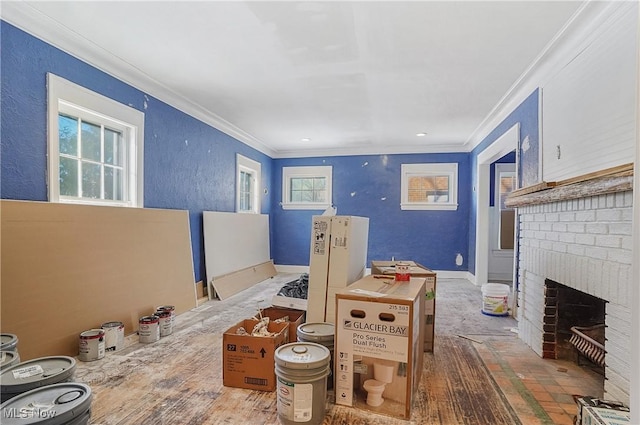 living room with a brick fireplace and crown molding