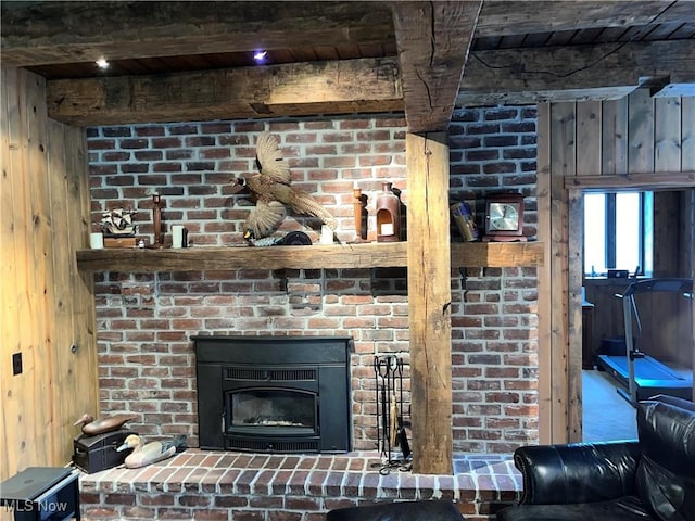 details featuring a brick fireplace and wood walls