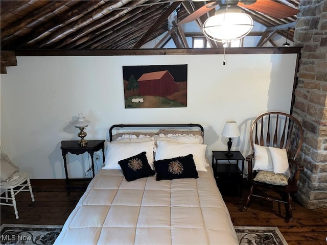 bedroom featuring wood-type flooring and lofted ceiling