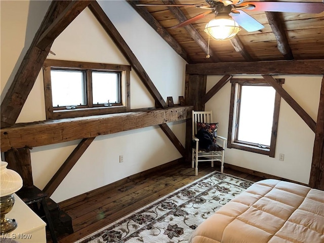 additional living space with wood ceiling, ceiling fan, dark hardwood / wood-style floors, and vaulted ceiling with beams