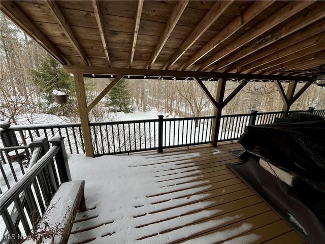 view of snow covered deck