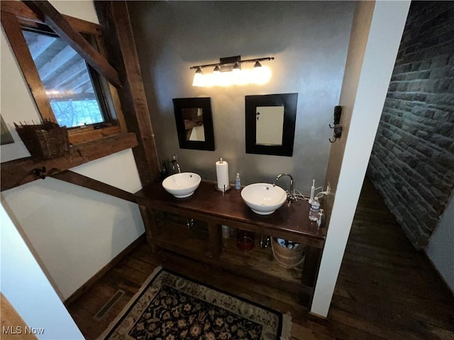 bathroom featuring hardwood / wood-style flooring and vanity