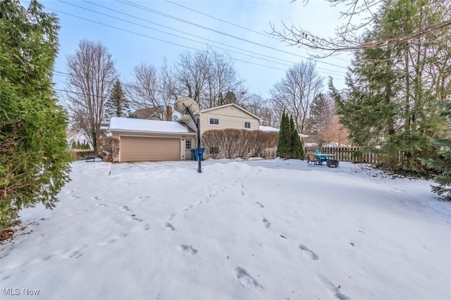 view of yard layered in snow