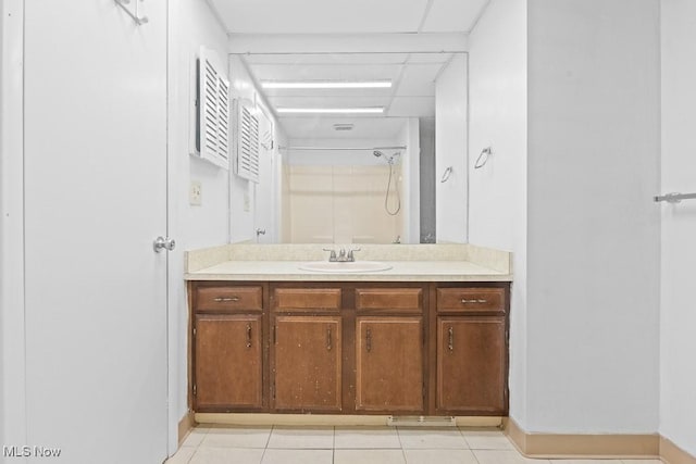 bathroom featuring tile patterned floors, a shower with shower curtain, and vanity