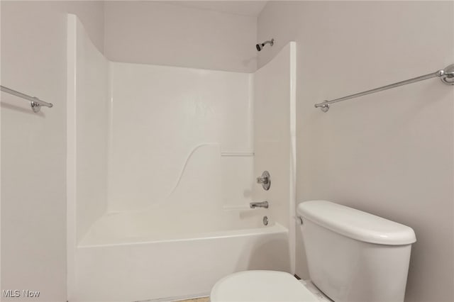 bathroom with shower / washtub combination and toilet