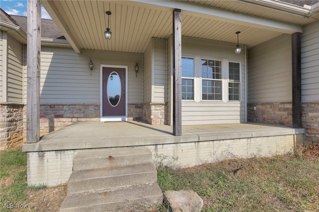 doorway to property featuring a porch