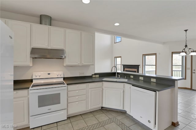 kitchen with white cabinetry, sink, and white appliances