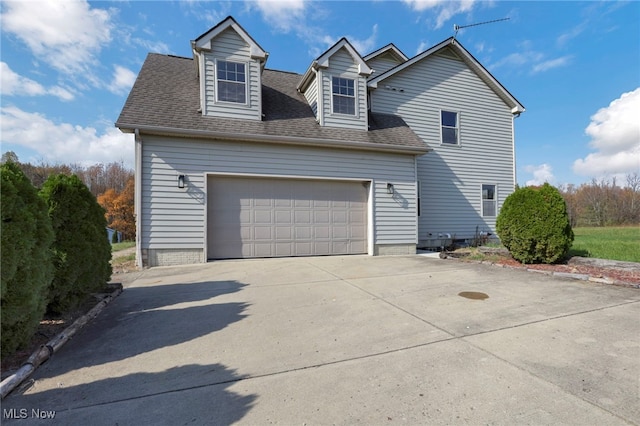 view of side of property with a garage