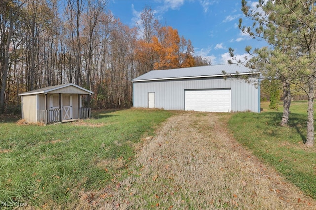 garage featuring a yard