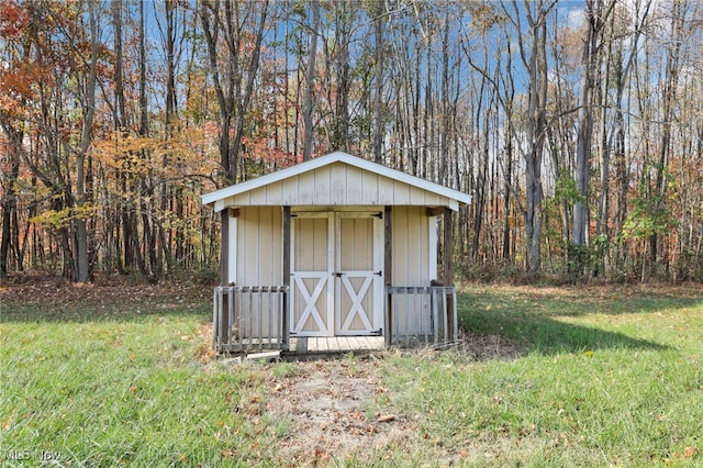 view of outdoor structure with a lawn