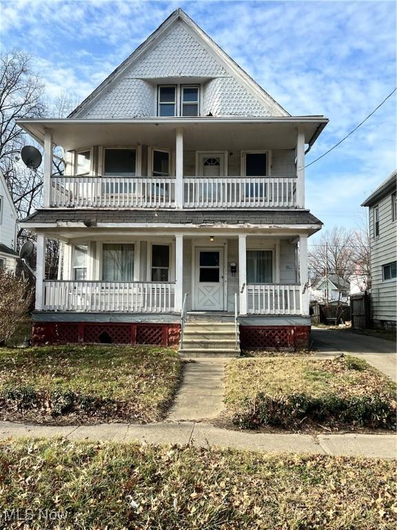 view of front facade with a porch and a balcony