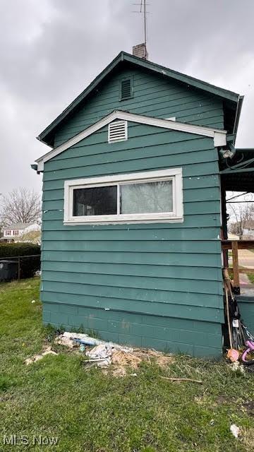 view of home's exterior featuring a lawn