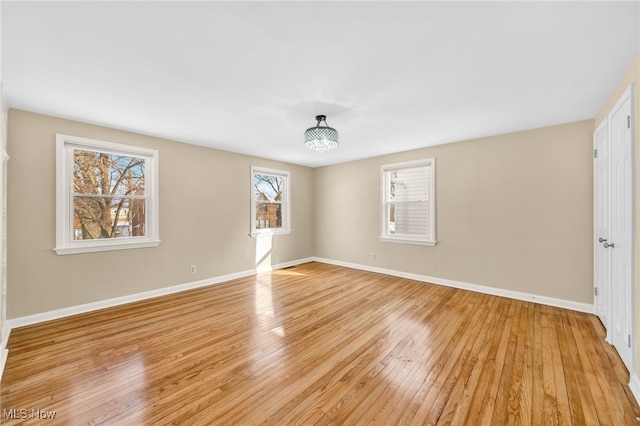 unfurnished room featuring light hardwood / wood-style floors