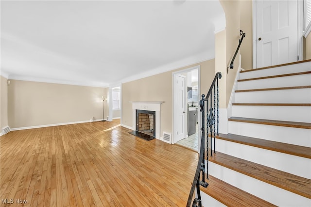 unfurnished living room featuring light hardwood / wood-style floors